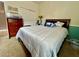 Bedroom with a dresser and white comforter at 724 Parker Den Dr, Ruskin, FL 33570