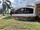 Bahia Lakes community sign featuring palm trees and manicured landscaping on a sunny day at 724 Parker Den Dr, Ruskin, FL 33570