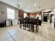The dining area features tile floors and is adjacent to kitchen, offering an open layout for everyday living at 724 Parker Den Dr, Ruskin, FL 33570