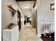 Hallway with tiled floors and neutral colored walls with access to other rooms at 724 Parker Den Dr, Ruskin, FL 33570