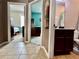 Hallway leading to a bedroom, an office space, and a bathroom at 724 Parker Den Dr, Ruskin, FL 33570