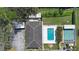 Overhead view highlighting a building, pool area, tennis court, and surrounding green space at 11200 102Nd Ave # 74, Seminole, FL 33778