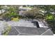 Aerial view of property featuring parking spaces, landscaping, and building rooftops at 11200 102Nd Ave # 74, Seminole, FL 33778
