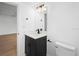 Bathroom featuring sleek black vanity with white countertop and modern fixtures at 11200 102Nd Ave # 74, Seminole, FL 33778