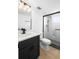 Modern bathroom with a black vanity, white countertop, and a glass-enclosed shower at 11200 102Nd Ave # 74, Seminole, FL 33778