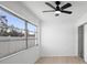 Well-lit bedroom with a ceiling fan and large window, offering a bright and airy space at 11200 102Nd Ave # 74, Seminole, FL 33778