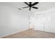 Bedroom features wood floors, a ceiling fan, and a closet with louvered doors at 11200 102Nd Ave # 74, Seminole, FL 33778
