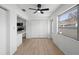 Well lit dining room featuring a modern ceiling fan and updated kitchen at 11200 102Nd Ave # 74, Seminole, FL 33778