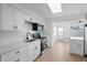 Contemporary kitchen boasts stainless appliances, white cabinets, and a sleek design for seamless cooking at 11200 102Nd Ave # 74, Seminole, FL 33778