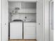 Convenient laundry closet featuring a washer, dryer, and ample storage shelving, maximizing space efficiency at 11200 102Nd Ave # 74, Seminole, FL 33778