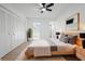 Cozy main bedroom with natural light, ceiling fan, a door to the exterior, and closet at 11200 102Nd Ave # 74, Seminole, FL 33778