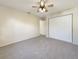 Bedroom featuring neutral carpet, a ceiling fan, and a closet at 18284 Yale Ave, Port Charlotte, FL 33948