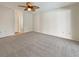 Bedroom features a ceiling fan, neutral paint, and carpet flooring at 18284 Yale Ave, Port Charlotte, FL 33948