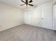 Bedroom featuring neutral carpet, a ceiling fan, and a closet at 18284 Yale Ave, Port Charlotte, FL 33948