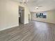 Open living space with wood look floors, neutral paint, and plenty of natural light at 18284 Yale Ave, Port Charlotte, FL 33948