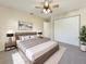 Relaxing main bedroom with neutral decor, a ceiling fan, and a closet at 18284 Yale Ave, Port Charlotte, FL 33948