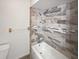 Clean bathroom with tub and modern tile at 2108 Tarpon Landings Dr, Tarpon Springs, FL 34688