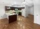 Well-equipped kitchen with granite counters, dark cabinets, and modern appliances at 2108 Tarpon Landings Dr, Tarpon Springs, FL 34688