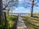 Pathway to the lake and dock at 2108 Tarpon Landings Dr, Tarpon Springs, FL 34688