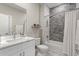 Bright bathroom featuring a marble vanity, tiled shower, and modern fixtures at 24470 Kingsway Cir, Punta Gorda, FL 33983