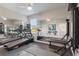 Spacious home gym with treadmills, weights, mirrors, and ample workout space at 24470 Kingsway Cir, Punta Gorda, FL 33983