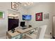 Stylish home office with modern desk, comfortable chair, and decorative wall art at 24470 Kingsway Cir, Punta Gorda, FL 33983