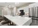 Bright kitchen with a large marble island, stainless steel appliances, and modern fixtures at 24470 Kingsway Cir, Punta Gorda, FL 33983
