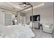 Luxurious main bedroom with a canopy bed, sliding barn door, and modern accents at 24470 Kingsway Cir, Punta Gorda, FL 33983