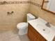 Cozy bathroom with tile flooring, white fixtures, and warm lighting at 301 Francis Dr, Apollo Beach, FL 33572