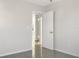 Neutral room with tile flooring and view of hallway through an open white door at 301 Francis Dr, Apollo Beach, FL 33572
