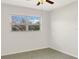 Bedroom with a large window and ceiling fan at 301 Francis Dr, Apollo Beach, FL 33572
