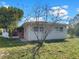 Exterior of a charming single story home with mature trees at 301 Francis Dr, Apollo Beach, FL 33572