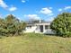 Charming single-story home featuring a covered porch and a well-maintained lawn at 301 Francis Dr, Apollo Beach, FL 33572