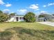Charming single story home with a well maintained lawn and covered parking at 301 Francis Dr, Apollo Beach, FL 33572