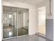 Sunroom featuring tile flooring with sliding glass door to another room and doorway to another room at 301 Francis Dr, Apollo Beach, FL 33572