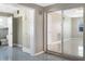 Hallway featuring tile flooring, storage, and access to the bathroom and bedroom at 301 Francis Dr, Apollo Beach, FL 33572