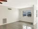 Bright living room with tile flooring, a ceiling fan, and a large window at 301 Francis Dr, Apollo Beach, FL 33572