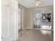 Living room with tile flooring, a sliding door to the screened patio, and storage at 301 Francis Dr, Apollo Beach, FL 33572
