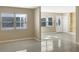 Living room featuring tile floors, large windows, and plenty of natural light at 301 Francis Dr, Apollo Beach, FL 33572