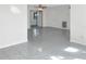 Bright living room featuring tile flooring, a ceiling fan, and natural light at 301 Francis Dr, Apollo Beach, FL 33572