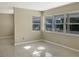 Open living room with tile floors and ample natural light from large windows at 301 Francis Dr, Apollo Beach, FL 33572