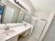 Bathroom featuring a double sink vanity and glass-enclosed shower at 1110 Mcdaniel St # 1110, Sun City Center, FL 33573