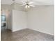 Spacious bedroom with neutral walls, ceiling fan, and tile flooring at 1110 Mcdaniel St # 1110, Sun City Center, FL 33573