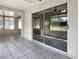 Sunroom with tile floors and sliding glass doors at 1110 Mcdaniel St # 1110, Sun City Center, FL 33573