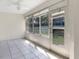 Bright sunroom with tile flooring and large windows overlooking the backyard at 1110 Mcdaniel St # 1110, Sun City Center, FL 33573