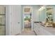 Bathroom view looking into a bedroom with decor and lots of natural light at 3165 Alba Cir, Bradenton, FL 34211