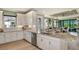 Open kitchen with stainless steel appliances and granite countertops at 3165 Alba Cir, Bradenton, FL 34211