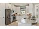 Bright kitchen with stainless steel appliances, white cabinetry, and granite countertops at 3165 Alba Cir, Bradenton, FL 34211