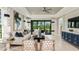 Bright living room featuring stylish furniture, ceiling fan and sliding glass doors to the outside at 3165 Alba Cir, Bradenton, FL 34211
