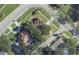 Aerial view shows property lines on a landscaped corner lot with mature trees and a pool at 515 Snell Isle Ne Blvd, St Petersburg, FL 33704